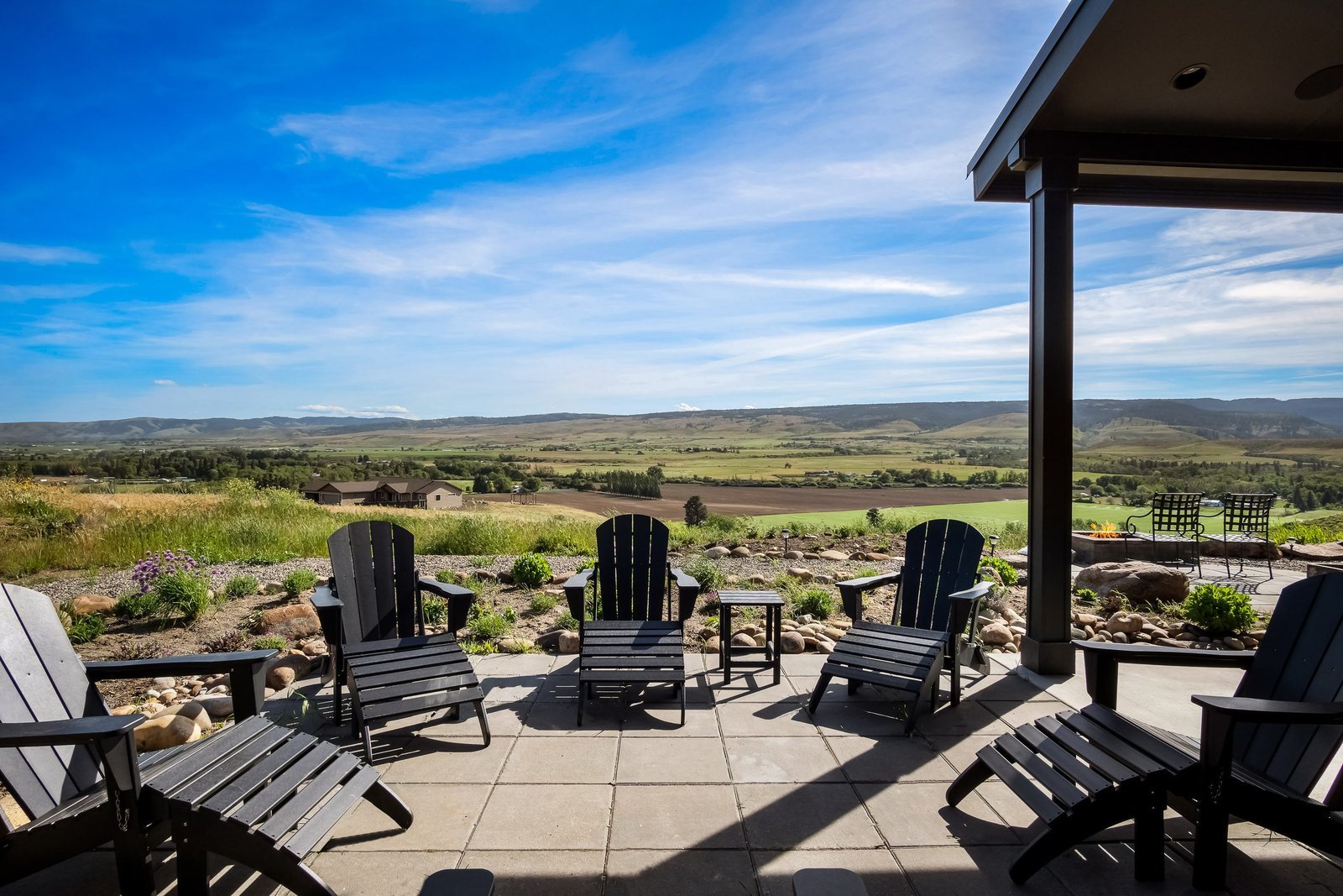 Outdoor deck with fire pit overlooking the river valley