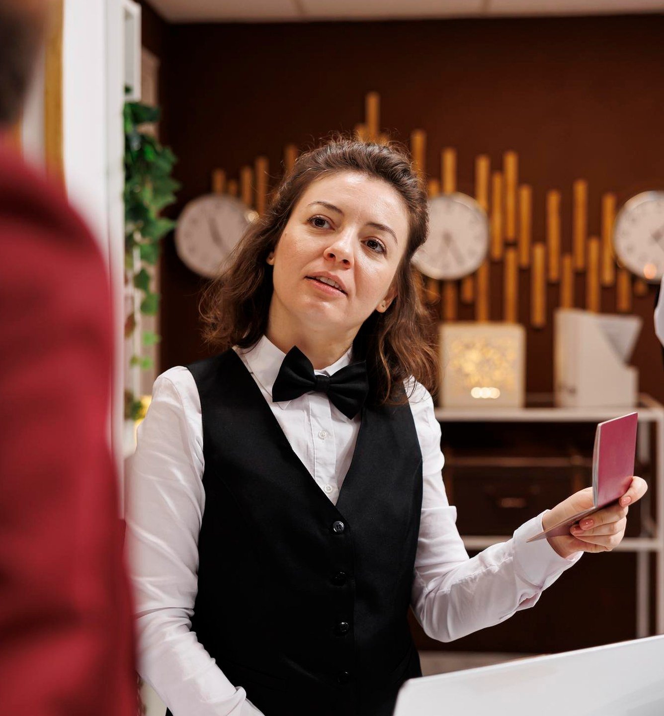 29 Nights concierge assisting a guest at check-in